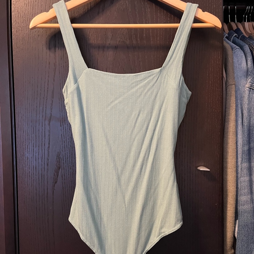 green bodysuit with lace up back